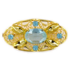 Oval perforated brooch with aquamarine stones, gilded 54x28 mm