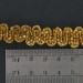 Gilded banding with glass tubes, waves pattern on cotton thread