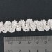 Silvered banding with glass tubes, waves pattern on cotton thread