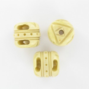 Barrel shaped bead with embossed patterns, beige 17x18 mm