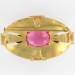 Broche ovale avec pierre rose, dorée 59x35 mm