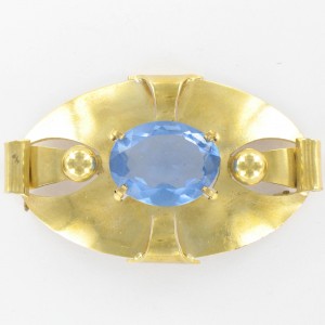 Oval brooch with light sapphire stone, gilded 59x35 mm